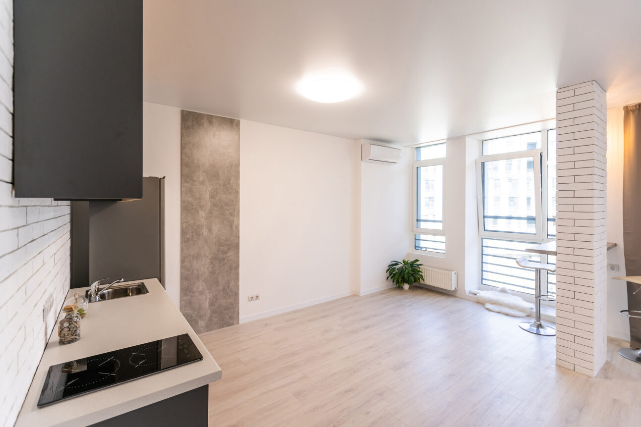 Room with unfinished walls and a room after repair. Before and after renovation in new housing.